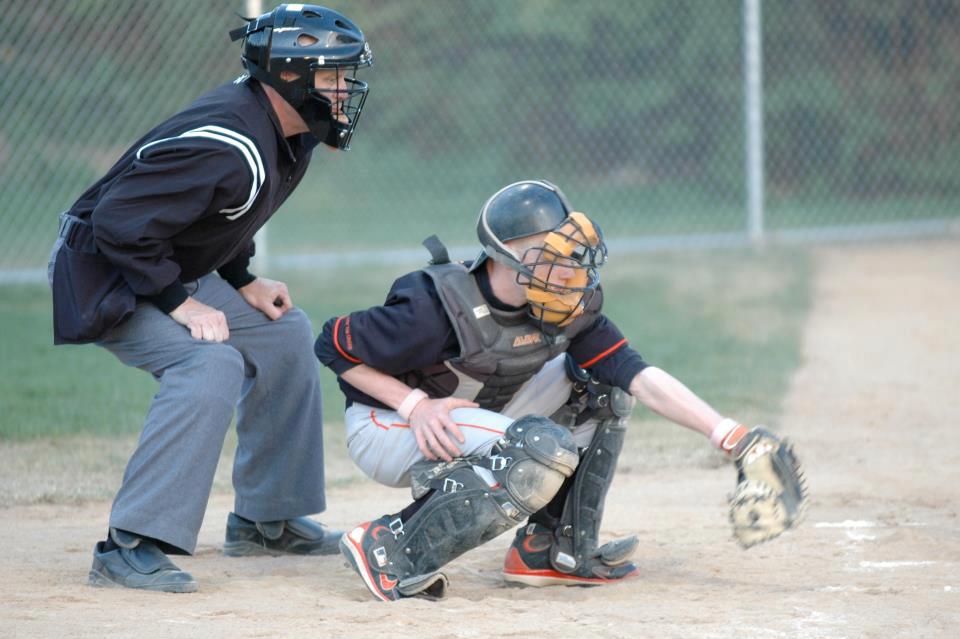 Umpire Wearing Helmet in Game